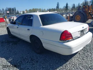 1999 Ford Crown Victoria LX with VIN 2FAFP74W7XX185341, listed as a IAAI auction lot 42020186 with 178,997 mi miles. Bid and sale history available at carsss.com. Image 3.