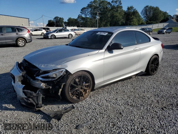 2015 BMW 2 Series M235i with VIN WBA1J7C57FV254038, listed as a Copart auction lot 73657294 with 117,883 mi miles and Salvage Title. Bid and sale history available at carsss.com. Image 1.
