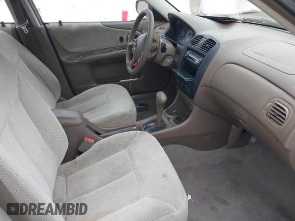 2000 Mazda Protege DX with VIN JM1BJ2223Y0212144, listed as a IAAI auction lot 41570436 with 221,430 mi miles and . Bid and sale history available at DreamBid. Image 5.