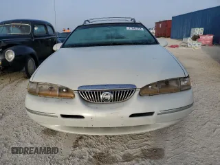 1997 Mercury Cougar z VIN 1MELM62W0VH602622, wystawiony jako Copart lot #77042354 z przebiegiem 122 027 mil mil oraz Nie do naprawy. Historia ofert i sprzedaży dostępna na DreamBid. Obrazek 5.
