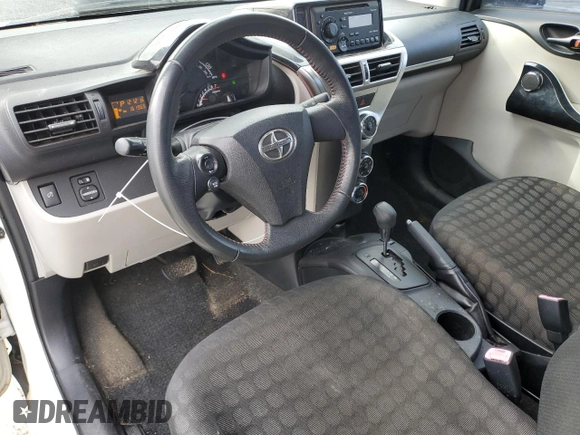 2012 Scion iQ with VIN JTNJJXB0XCJ011508, listed as a Copart auction lot 42368065 with 161,965 mi miles and Salvage title. Bid and sale history available at DreamBid. Image 8.