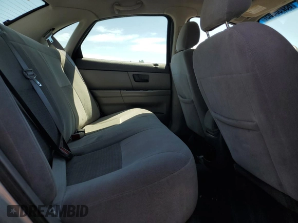 2005 Ford Taurus SE with VIN 1FAFP53U25A303516, listed as a Copart auction lot 63250505 with 203,463 mi miles and Salvage title. Bid and sale history available at DreamBid. Image 10.