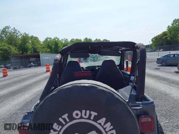 2001 Jeep Wrangler Sport z VIN 1J4FA49S11P322636, wystawiony jako IAAI lot #42409917 z przebiegiem 88 675 mil mil oraz . Historia ofert i sprzedaży dostępna na DreamBid. Obrazek 14.