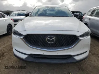 2019 Mazda CX-5 Signature with VIN JM3KFBEYXK0537826, listed as a Copart auction lot 50063015 with 76,448 mi miles and Salvage Title. Bid and sale history available at carsss.com. Image 5.