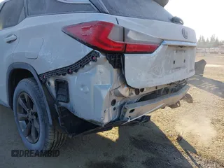 2018 Lexus RX 350L Premium z VIN JTJDZKCAXJ2008164, wystawiony jako IAAI lot #41436168 z przebiegiem 126 798 mil mil oraz . Historia ofert i sprzedaży dostępna na DreamBid. Obrazek 19.