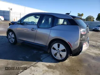 2015 BMW i3 with VIN WBY1Z4C56FV500991, listed as a Copart auction lot 43162913 with 57,885 mi miles. Bid and sale history available at carsss.com. Image 2.