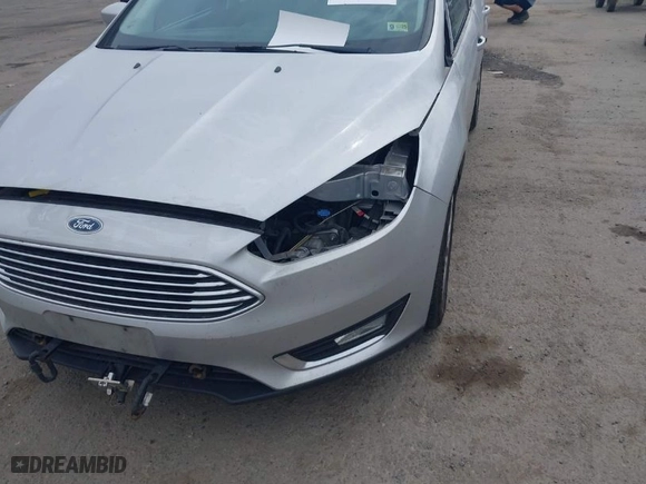 2015 Ford Focus Titanium with VIN 1FADP3N27FL228549, listed as a IAAI auction lot 41912941 with 69,025 mi miles. Bid and sale history available at carsss.com. Image 6.