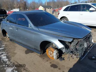 2015 Infiniti Q50 z VIN JN1BV7AR9FM403964, wystawiony jako IAAI lot #41457955 z przebiegiem 141 035 mil mil oraz . Historia ofert i sprzedaży dostępna na DreamBid. Obrazek 1.