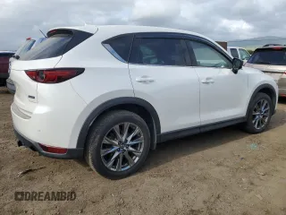 2019 Mazda CX-5 Signature with VIN JM3KFBEYXK0537826, listed as a Copart auction lot 50063015 with 76,448 mi miles and Salvage Title. Bid and sale history available at carsss.com. Image 3.