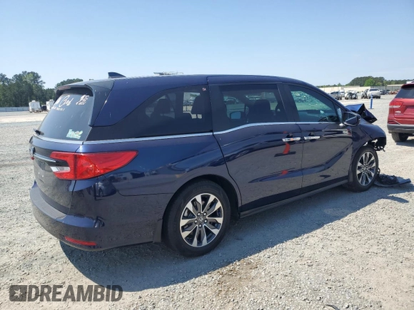 2023 Honda Odyssey EX-L z VIN 5FNRL6H66PB059463, wystawiony jako Copart lot #52288865 z przebiegiem Nie podano mil oraz Szkody całkowita. Historia ofert i sprzedaży dostępna na DreamBid. Obrazek 3.