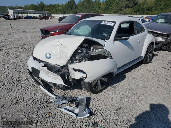 2012 Volkswagen Beetle 2.0T Turbo w/Sun/Sound PZEV with VIN 3VWVA7AT9CM612734, listed as a Copart auction lot 69196224 with 0 mi miles and Salvage Title. Bid and sale history available at carsss.com. Image 1.