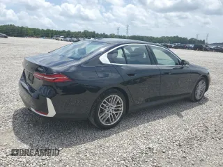 2024 BMW 5 Series 530i with VIN WBA43FJ09RCR05243, listed as a Copart auction lot 61690705 with 34,450 mi miles and Salvage title. Bid and sale history available at DreamBid. Image 3.