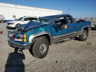 1998 GMC Sierra 2500 z VIN 1GTGK29RXWE507912, wystawiony jako Copart lot #67655674 z przebiegiem 165 538 mil mil oraz Szkody całkowita. Historia ofert i sprzedaży dostępna na DreamBid. Obrazek 1.
