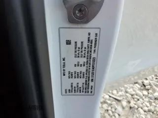 2023 Tesla Model 3 with VIN 5YJ3E1EA6PF510323, listed as a Copart auction lot 52094495 with 115,928 mi miles and Salvage Title. Bid and sale history available at DreamBid. Image 13.