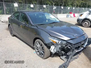 2018 Mazda 3 Touring z VIN 3MZBN1V33JM260505, wystawiony jako IAAI lot #42452858 z przebiegiem 63 495 mil mil oraz . Historia ofert i sprzedaży dostępna na DreamBid. Obrazek 1.