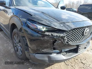 2022 Mazda CX-30 S with VIN 3MVDMBALXNM402265, listed as a IAAI auction lot 41458605 with 76,291 mi miles and . Bid and sale history available at carsss.com. Image 6.
