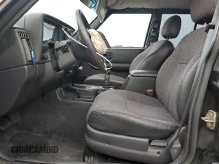1999 Jeep Cherokee Sport with VIN 1J4FF68S7XL560943, listed as a Copart auction lot 58425505 with 68,654 mi miles and Salvage title. Bid and sale history available at DreamBid. Image 7.