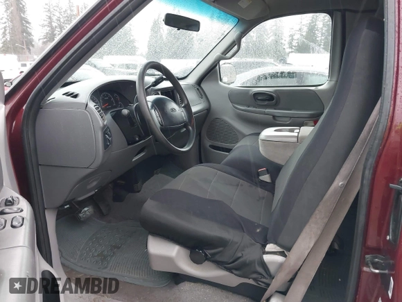 1999 Ford F-150 XL with VIN 2FTRX18L1XCA54790, listed as a IAAI auction lot 41556984 with 257,673 mi miles. Bid and sale history available at carsss.com. Image 5.