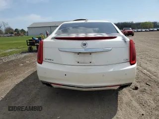 2013 Cadillac XTS Platinum z VIN 2G61V5S38D9204439, wystawiony jako Copart lot #53886495 z przebiegiem 89 940 mil mil oraz Szkody całkowita. Historia ofert i sprzedaży dostępna na DreamBid. Obrazek 6.