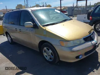 2001 Honda Odyssey EX z VIN 2HKRL186X1H543471, wystawiony jako IAAI lot #42290558 z przebiegiem 215 703 mil mil oraz . Historia ofert i sprzedaży dostępna na DreamBid. Obrazek 1.