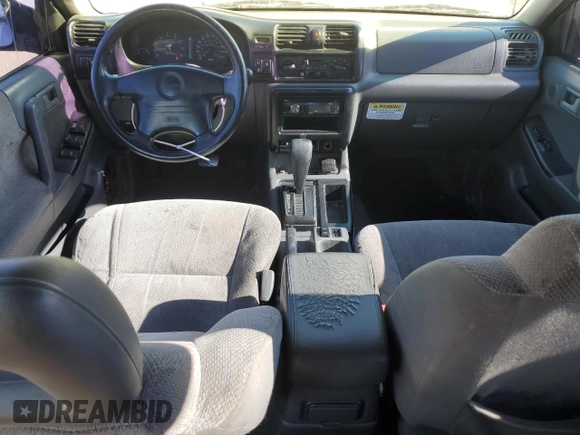 1999 Isuzu Rodeo S with VIN 4S2CK58WXX4373485, listed as a Copart auction lot 87804995 with 246,518 mi miles and Salvage title. Bid and sale history available at DreamBid. Image 8.