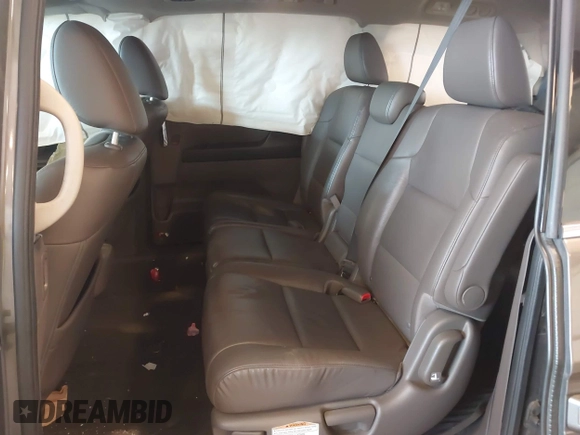 2014 Honda Odyssey Touring with VIN 5FNRL5H99EB105059, listed as a IAAI auction lot 42457672 with 240,581 mi miles and . Bid and sale history available at DreamBid. Image 8.