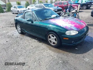 1999 Mazda MX-5 Miata z VIN JM1NB3537X0123440, wystawiony jako IAAI lot #42263294 z przebiegiem 107 356 mil mil oraz . Historia ofert i sprzedaży dostępna na DreamBid. Obrazek 1.