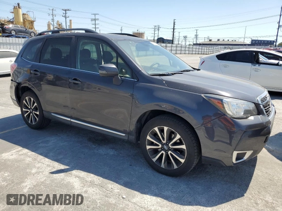 2017 Subaru Forester Touring with VIN JF2SJGWC1HH476823, listed as a Copart auction lot 59230835 with 107,711 mi miles and Salvage title. Bid and sale history available at DreamBid. Image 4.