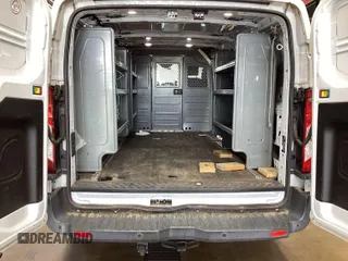 2018 Ford Transit with VIN 1FTBW2ZM8JKA77066, listed as a IAAI auction lot 42642396 with 215,234 mi miles and . Bid and sale history available at DreamBid. Image 14.