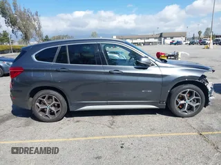 2018 BMW X1 sDrive28i with VIN WBXHU7C36J5L05628, listed as a IAAI auction lot 41708522 with 91,352 mi miles and . Bid and sale history available at DreamBid. Image 14.