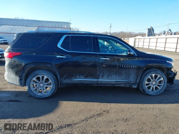 2018 Chevrolet Traverse Premier z VIN 1GNEVJKW5JJ174261, wystawiony jako IAAI lot #41656906 z przebiegiem 101 908 mil mil oraz . Historia ofert i sprzedaży dostępna na DreamBid. Obrazek 13.