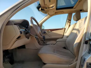 2000 Mercedes-Benz E-Class with VIN WDBJH65J4YB071699, listed as a Copart auction lot 75082144 with 105,989 mi miles and Salvage Title. Bid and sale history available at carsss.com. Image 7.