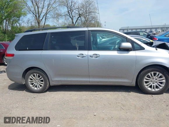 2014 Toyota Sienna XLE with VIN 5TDYK3DC9ES413283, listed as a IAAI auction lot 42091379 with 184,506 mi miles and . Bid and sale history available at DreamBid. Image 13.
