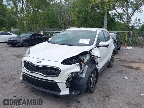 2021 Kia Sportage EX with VIN KNDPN3AC5M7856515, listed as a IAAI auction lot 41879128 with 56,537 mi miles and . Bid and sale history available at DreamBid. Image 6.