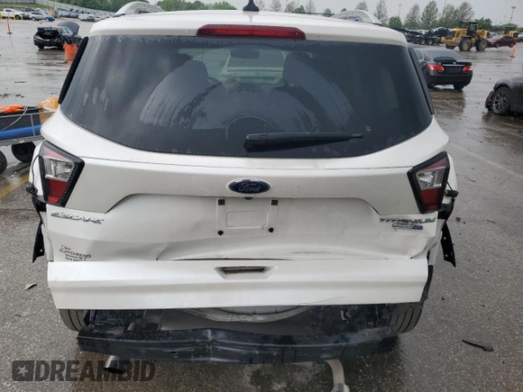 2018 Ford Escape Titanium z VIN 1FMCU9J94JUB49827, wystawiony jako Copart lot #55697385 z przebiegiem 98 682 mil mil oraz Szkoda całkowita • Salvage title. Historia ofert i sprzedaży dostępna na DreamBid. Obrazek 6.