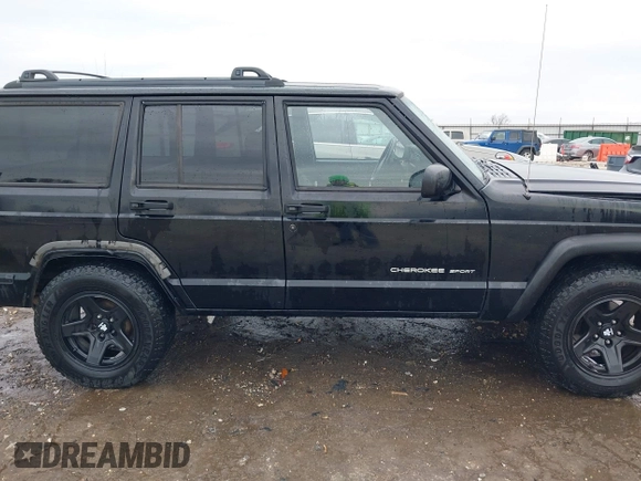 1999 Jeep Cherokee Sport with VIN 1J4FT68S6XL598558, listed as a IAAI auction lot 41549504 with 238,004 mi miles. Bid and sale history available at carsss.com. Image 13.