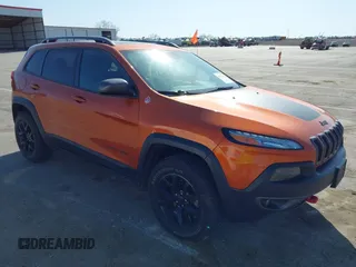 2016 Jeep Cherokee Trailhawk with VIN 1C4PJMBBXGW251682, listed as a IAAI auction lot 41973696 with 100,411 mi miles. Bid and sale history available at carsss.com. Image 1.
