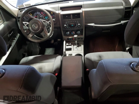 2012 Jeep Liberty Sport with VIN 1C4PJMAK1CW129000, listed as a Copart auction lot 49472635 with 77,124 mi miles and Salvage Title. Bid and sale history available at DreamBid. Image 8.