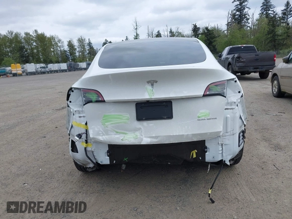 2021 Tesla Model Y Long Range with VIN 5YJYGDEE6MF082883, listed as a IAAI auction lot 42078807 with 64,953 mi miles. Bid and sale history available at carsss.com. Image 17.