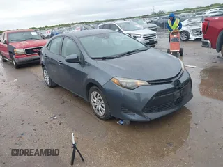 2019 Toyota Corolla L with VIN 5YFBURHE8KP873067, listed as a IAAI auction lot 41936471 with 75,076 mi miles. Bid and sale history available at carsss.com. Image 1.