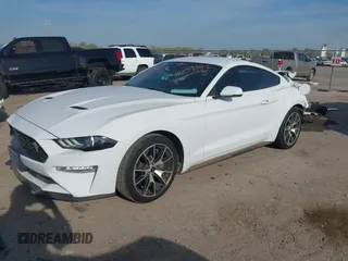 2021 Ford Mustang EcoBoost z VIN 1FA6P8TD5M5133239, wystawiony jako IAAI lot #41899042 z przebiegiem 65 553 mil mil oraz . Historia ofert i sprzedaży dostępna na DreamBid. Obrazek 2.