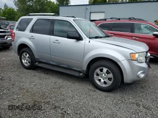 2010 Ford Escape Limited with VIN 1FMCU0EG9AKA54244, listed as a Copart auction lot 56930955 with 88,496 mi miles and Salvage title. Bid and sale history available at DreamBid. Image 4.