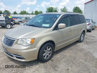 2011 Chrysler Town & Country Touring with VIN 2A4RR5DGXBR613179, listed as a IAAI auction lot 42143355 with 180,906 mi miles and . Bid and sale history available at DreamBid. Image 2.