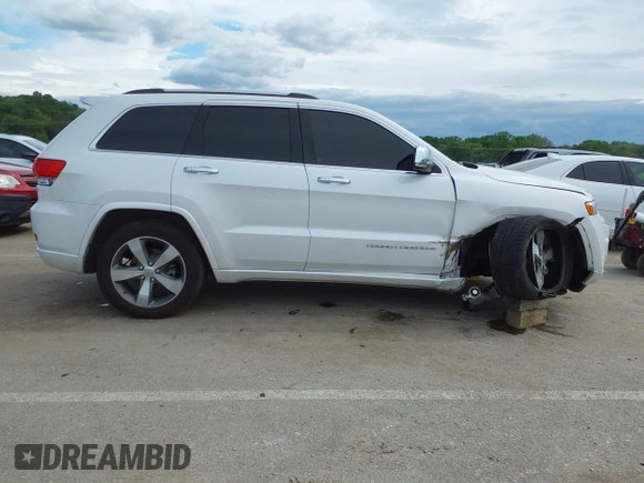 2016 Jeep Grand Cherokee Overland with VIN 1C4RJFCG2GC490420, listed as a IAAI auction lot 42200700 with 97,007 mi miles and . Bid and sale history available at DreamBid. Image 13.