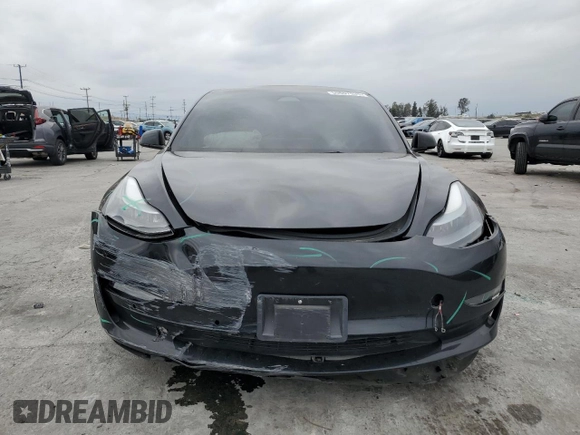 2022 Tesla Model 3 with VIN 5YJ3E1EA3NF190102, listed as a Copart auction lot 50657535 with 73,015 mi miles and Salvage Title. Bid and sale history available at DreamBid. Image 5.