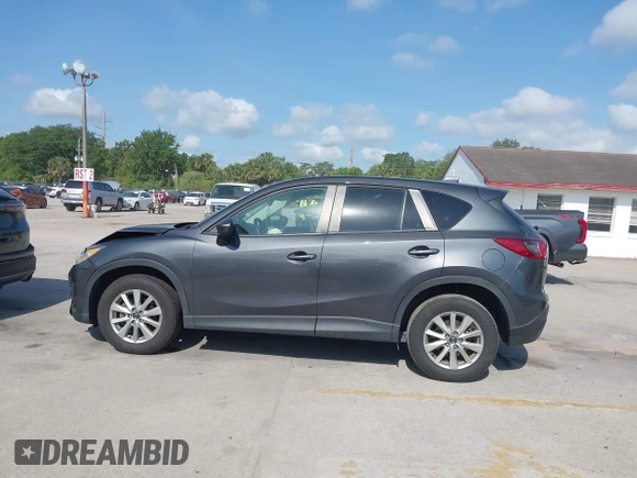2015 Mazda CX-5 Touring with VIN JM3KE2CY9F0468199, listed as a IAAI auction lot 42099253 with 110,909 mi miles and . Bid and sale history available at carsss.com. Image 14.
