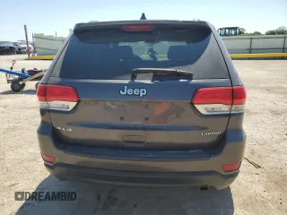 2016 Jeep Grand Cherokee Laredo with VIN 1C4RJFAG2GC328841, listed as a Copart auction lot 63553435 with 100,472 mi miles and Salvage title. Bid and sale history available at DreamBid. Image 6.