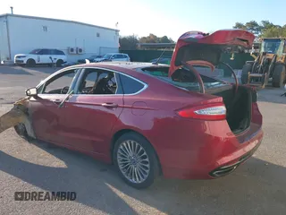 2014 Ford Fusion Titanium with VIN 3FA6P0K97ER145700, listed as a IAAI auction lot 42056362 with 122,000 mi miles. Bid and sale history available at carsss.com. Image 3.