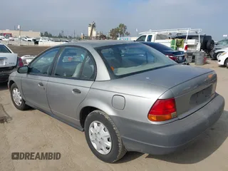 1999 Saturn SL z VIN 1G8ZH5280XZ249494, wystawiony jako IAAI lot #42347493 z przebiegiem 106 491 mil mil oraz . Historia ofert i sprzedaży dostępna na DreamBid. Obrazek 3.