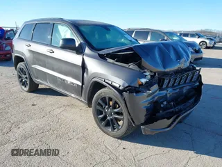 2017 Jeep Grand Cherokee Laredo with VIN 1C4RJFAG7HC769642, listed as a IAAI auction lot 41367874 with 128,095 mi miles. Bid and sale history available at carsss.com. Image 1.